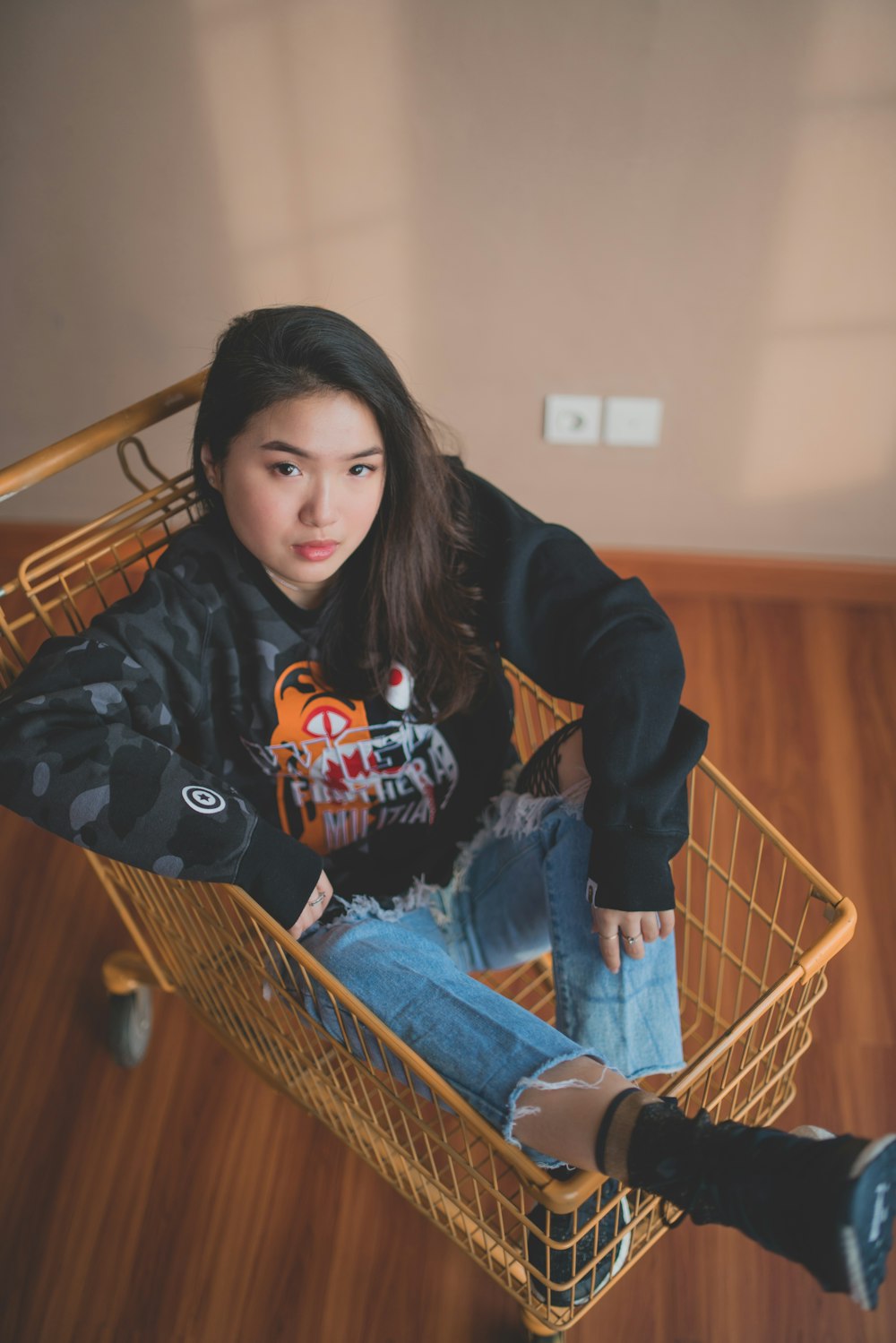 woman in jacket sits in cart