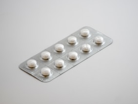 gray blister pack on white surface