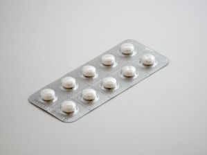 gray blister pack on white surface