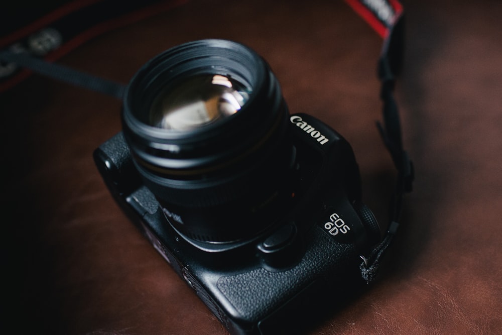 black Canon EOS 5D DSLR camera
