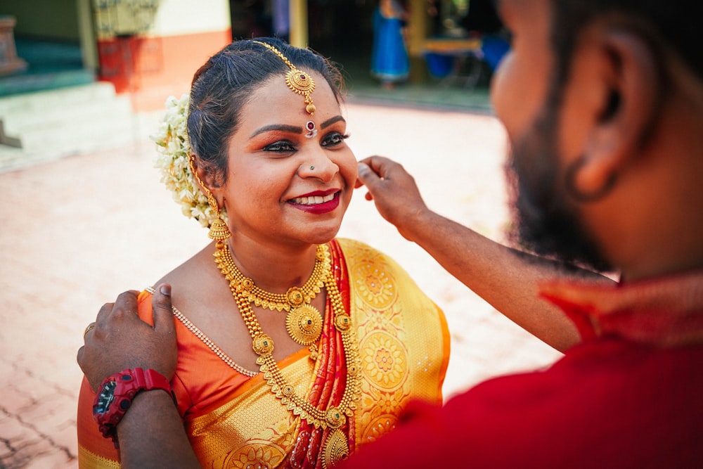 man holding woman's cheeks