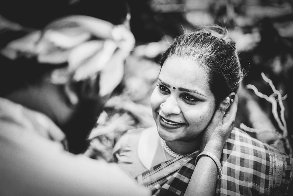 man holding woman's cheeks