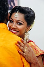 An Indian recruiter engaging warmly with a job seeker during an interview.