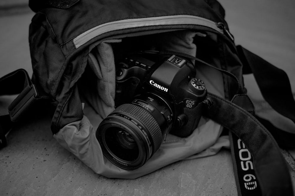 black Canon EOS 6D camera on bag