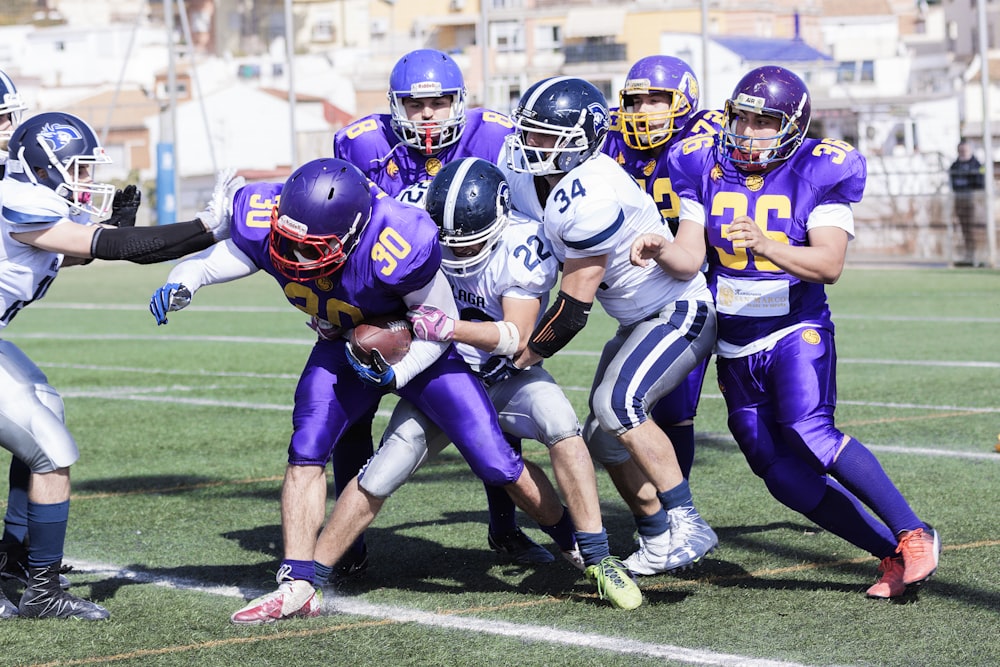 men playing American football during daytime