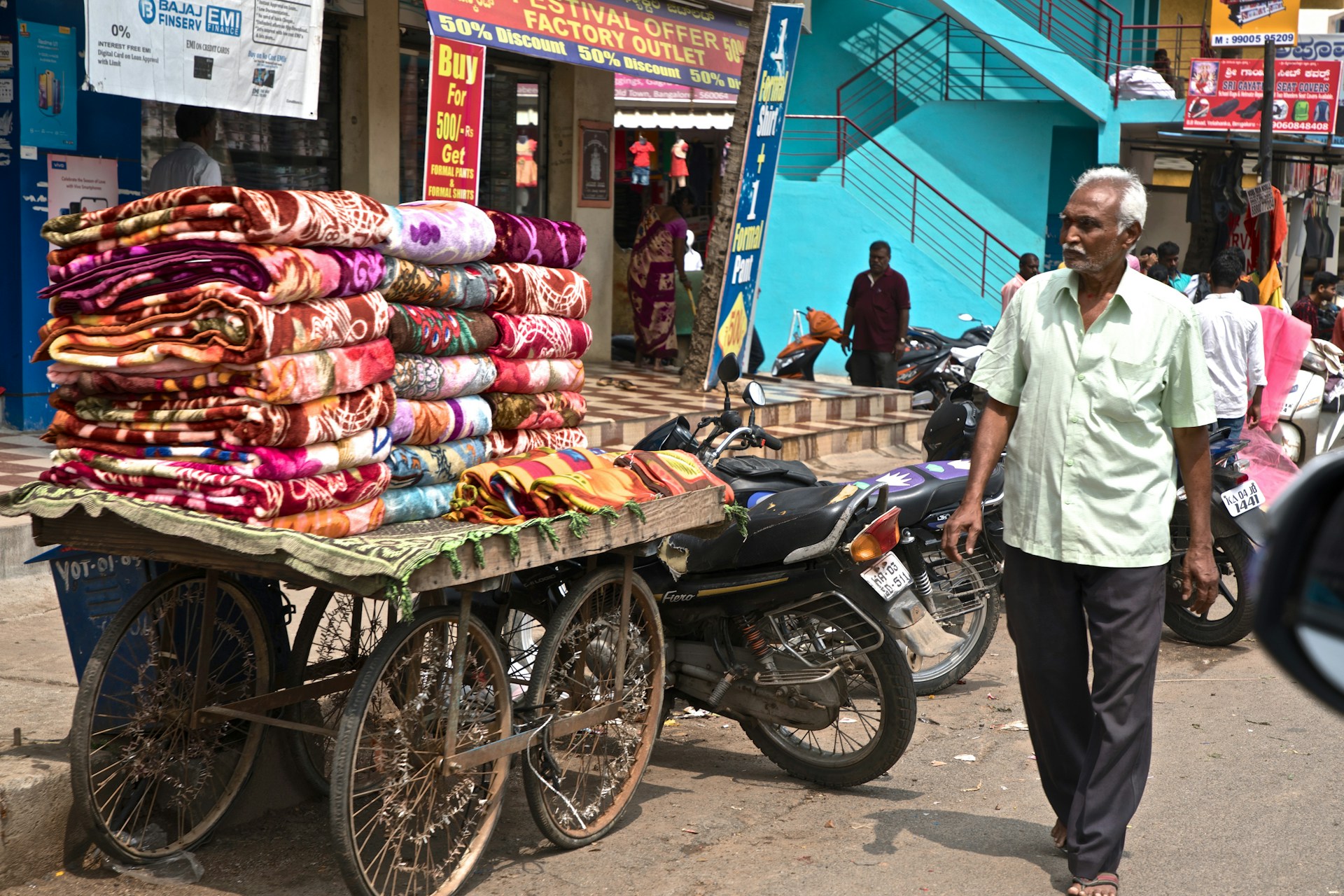 woman wearing yellow long-sleeved dress under white clouds and blue sky during daytime