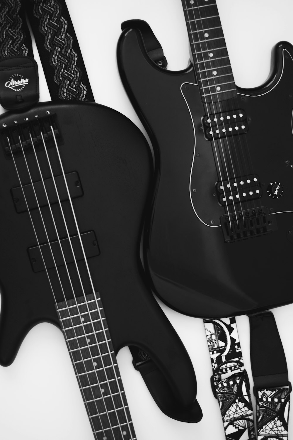 grayscale photo of electric guitars