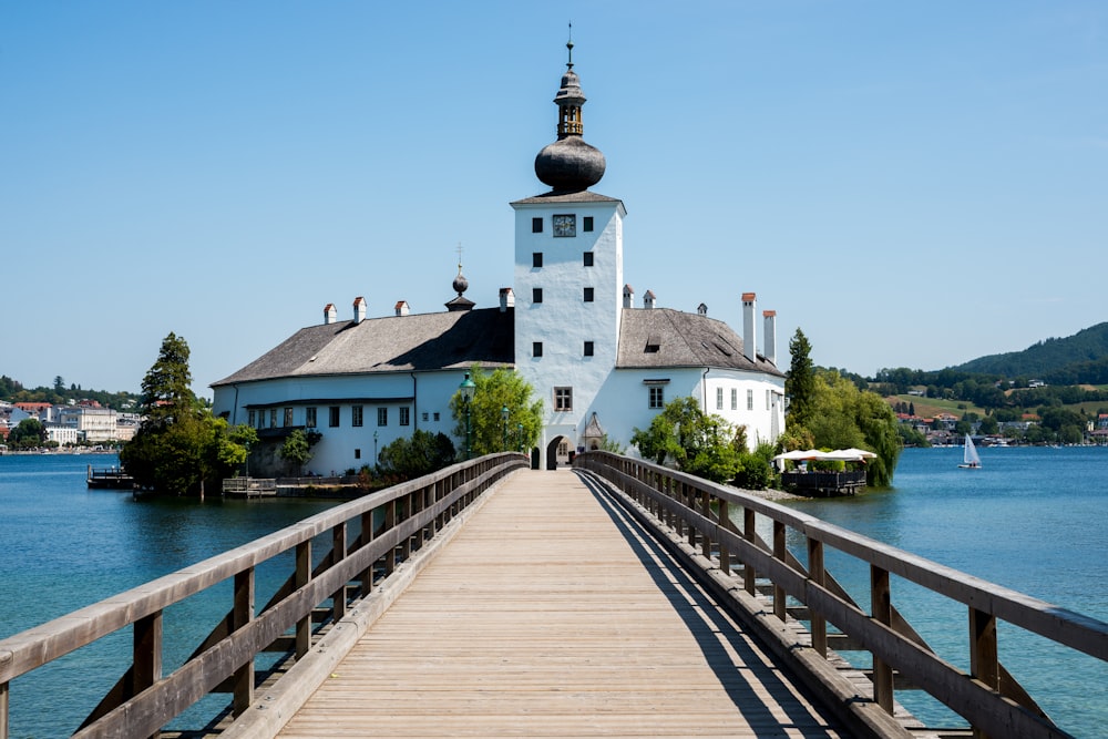 photo of white and brown mosque and pier