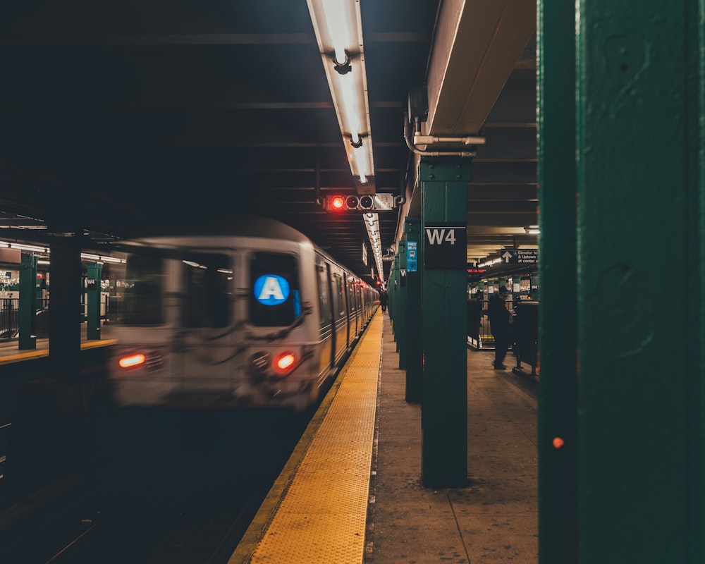 people standing on train station