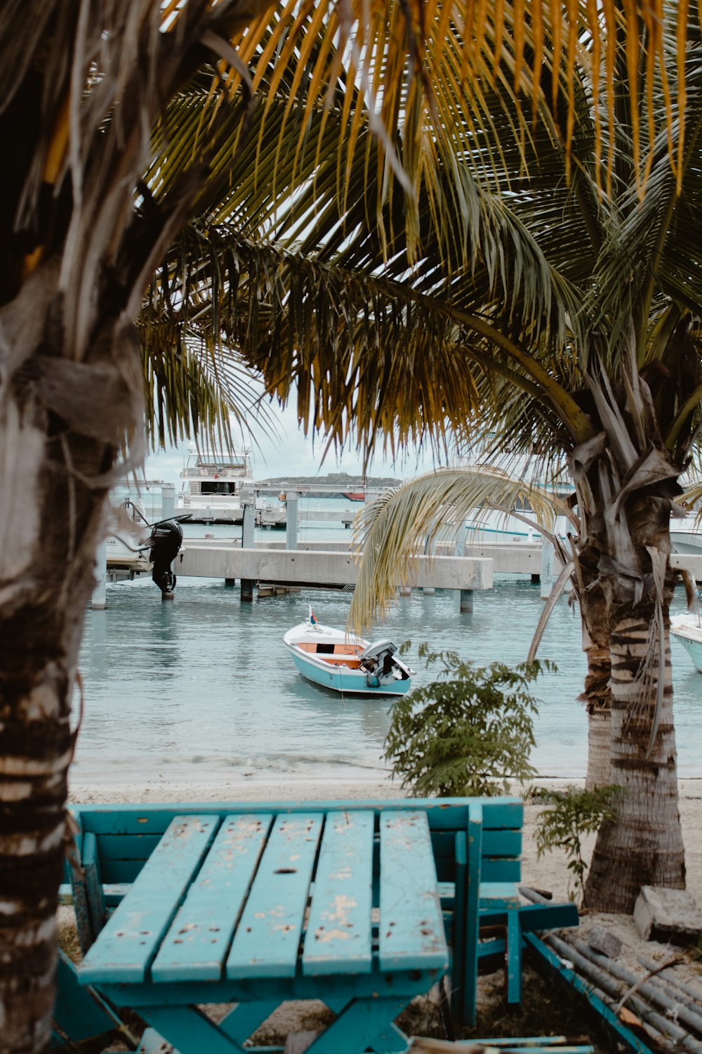 white clinker boat on body of water