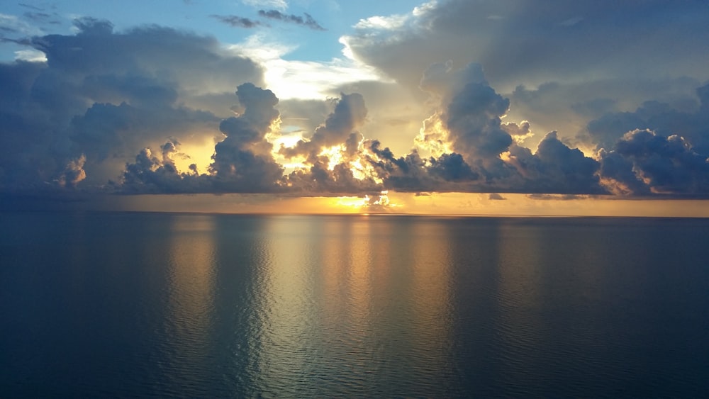 calm sea water during golden hour