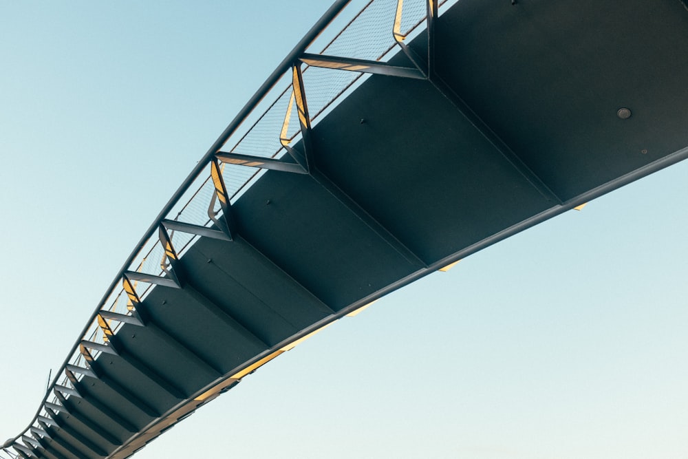 low-angle photo of steel bridge