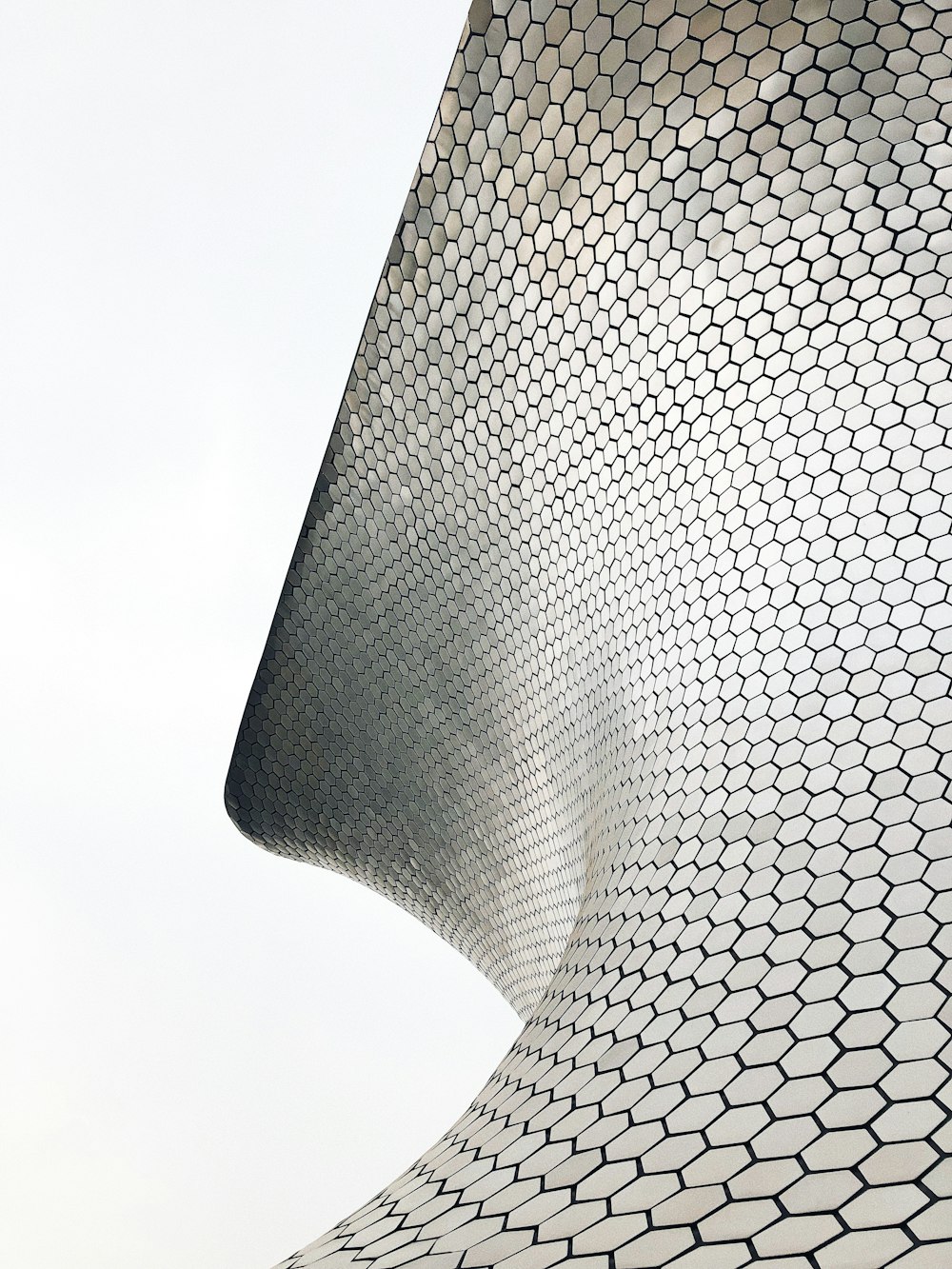 closeup photo of black and gray metal spiral pad