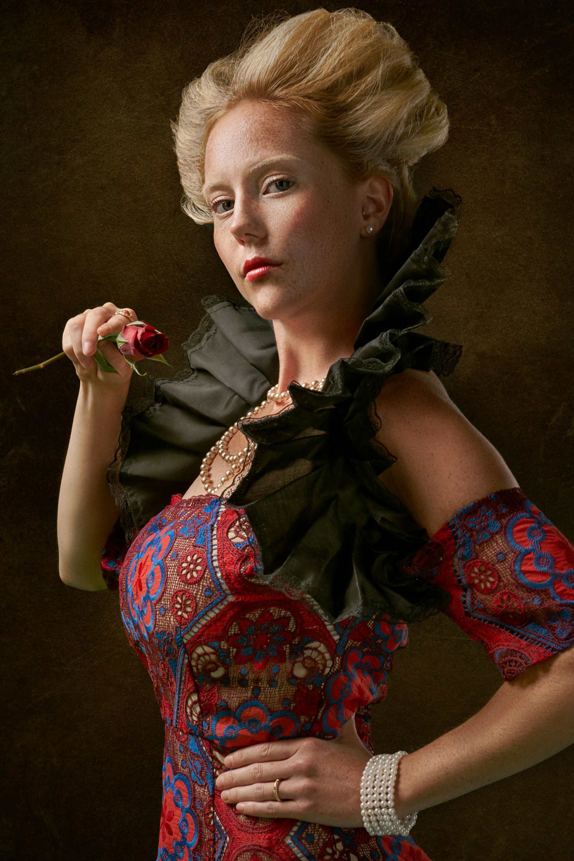 woman holding dried flower
