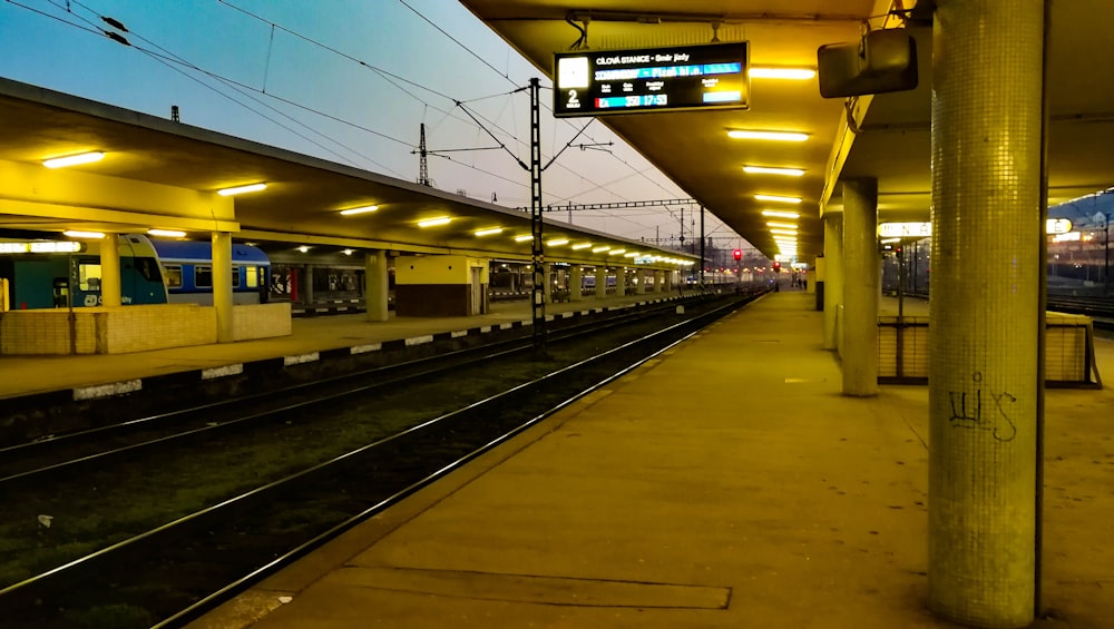 a train station with a train on the tracks