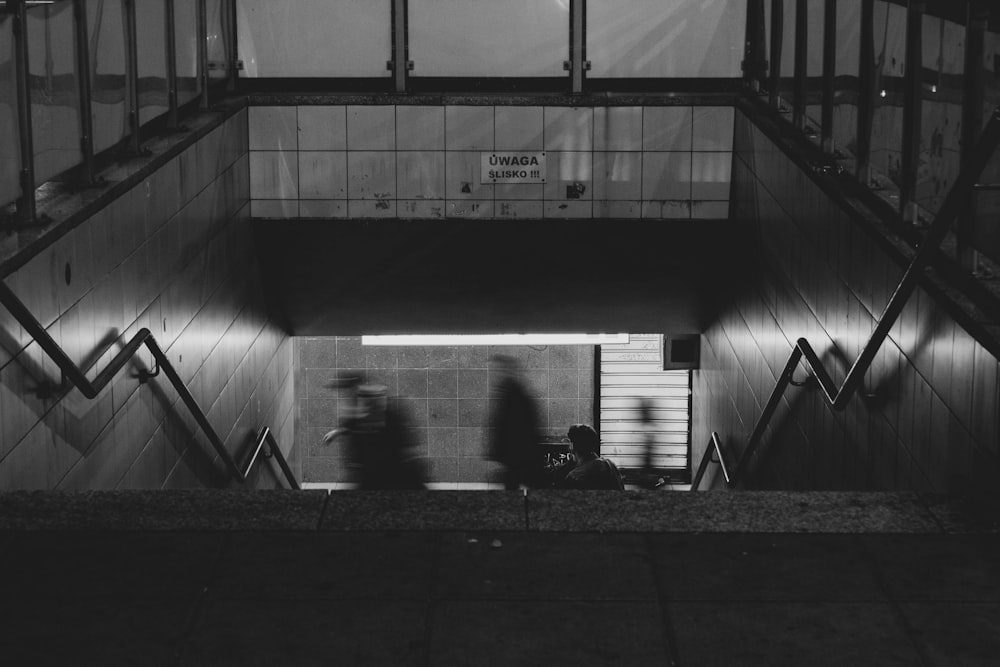 grayscale photo of underground train station