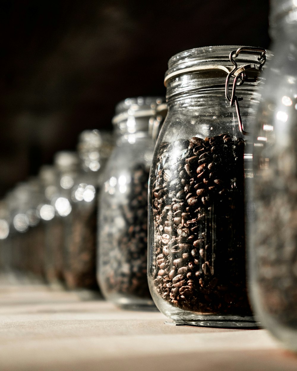 clear glass jar filled with coffee bean lot