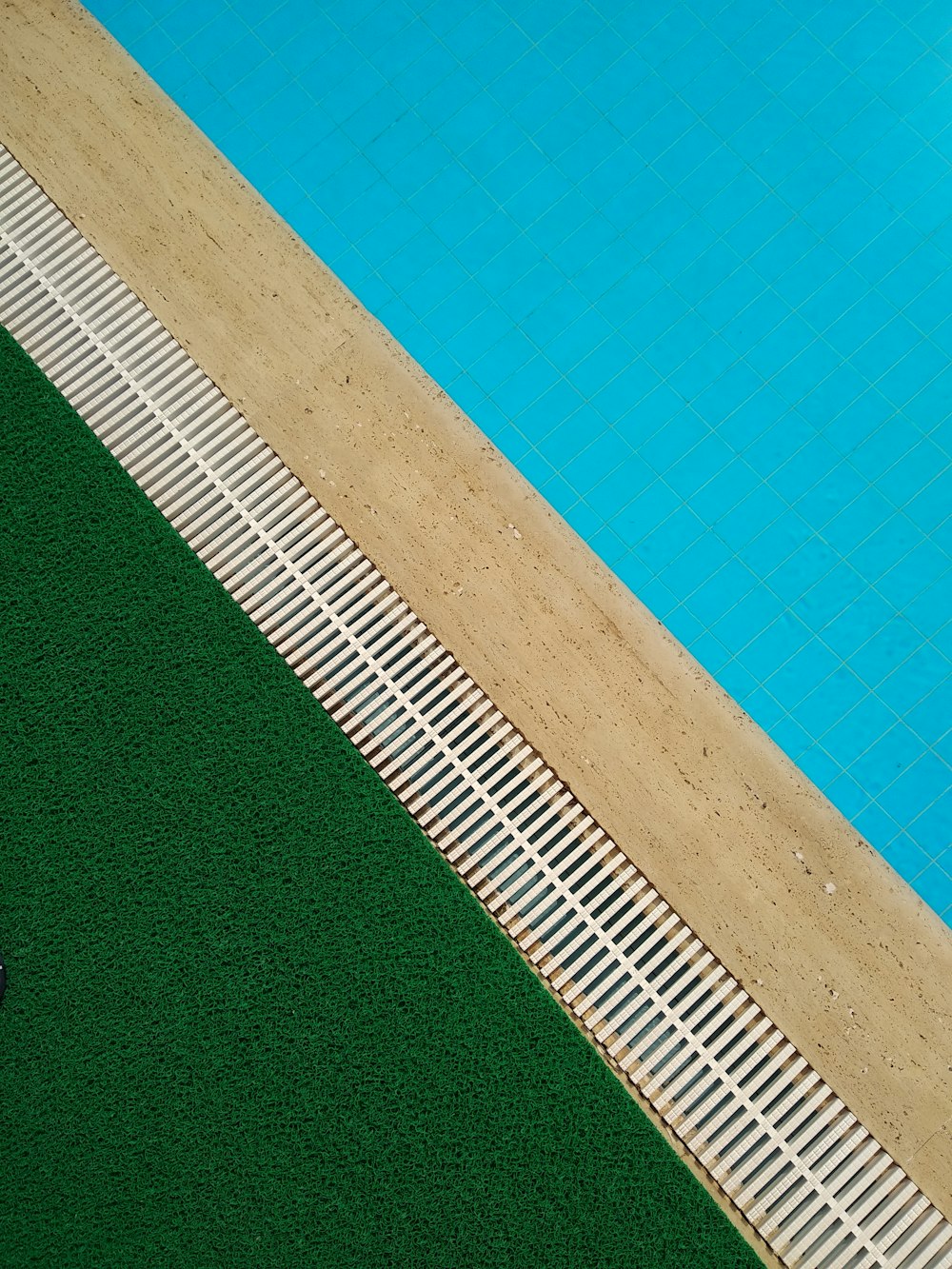 photo of pool and green grass