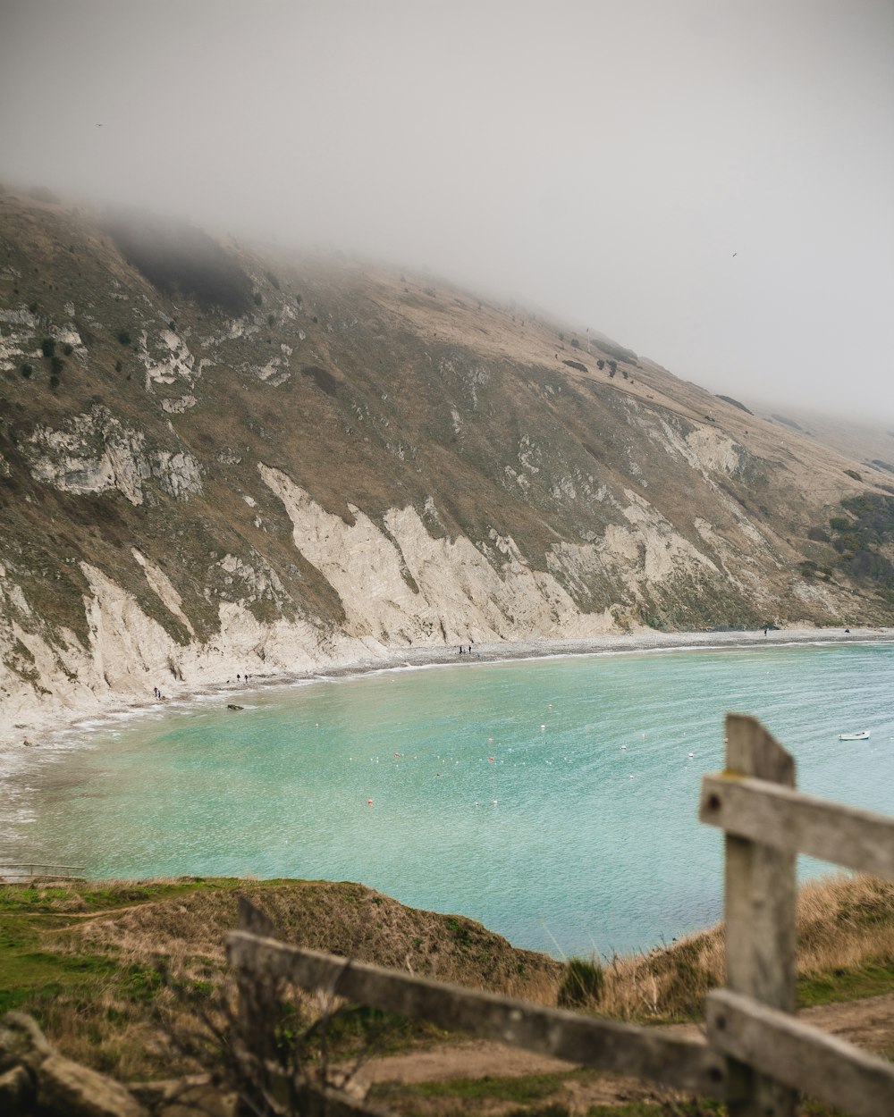 body of water near cliff