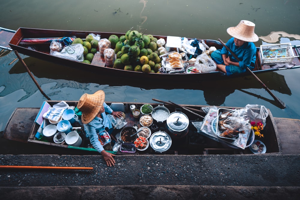 two people on boats