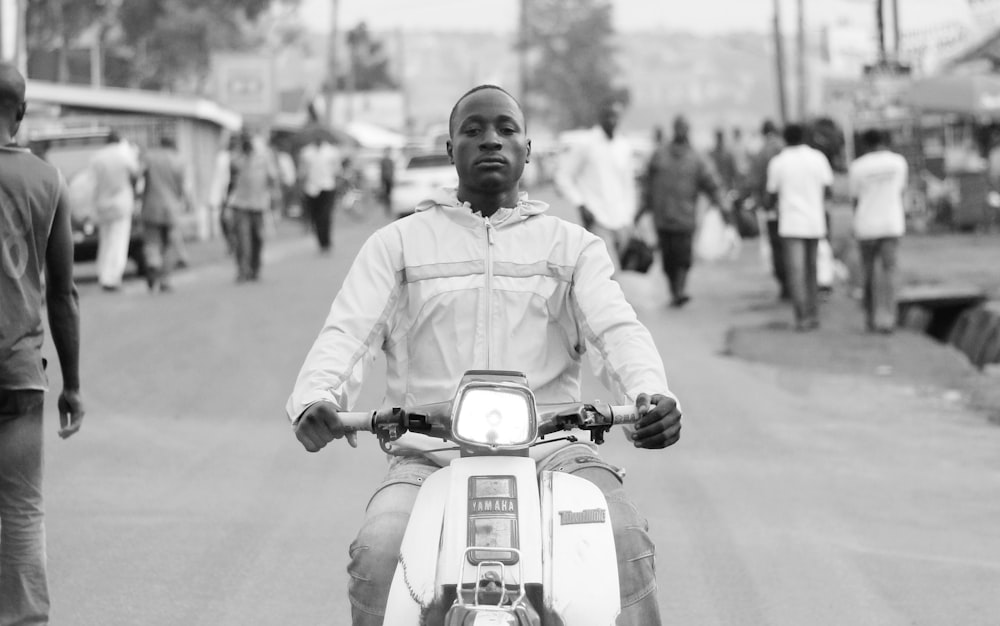 man riding on motorcycle