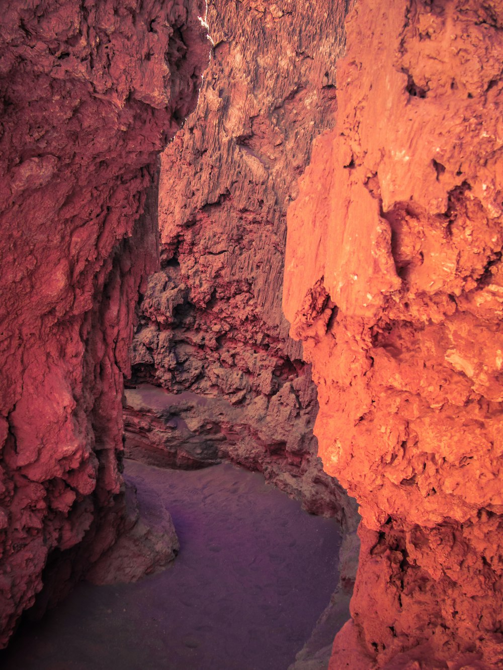 a small pool of water in the middle of a cave