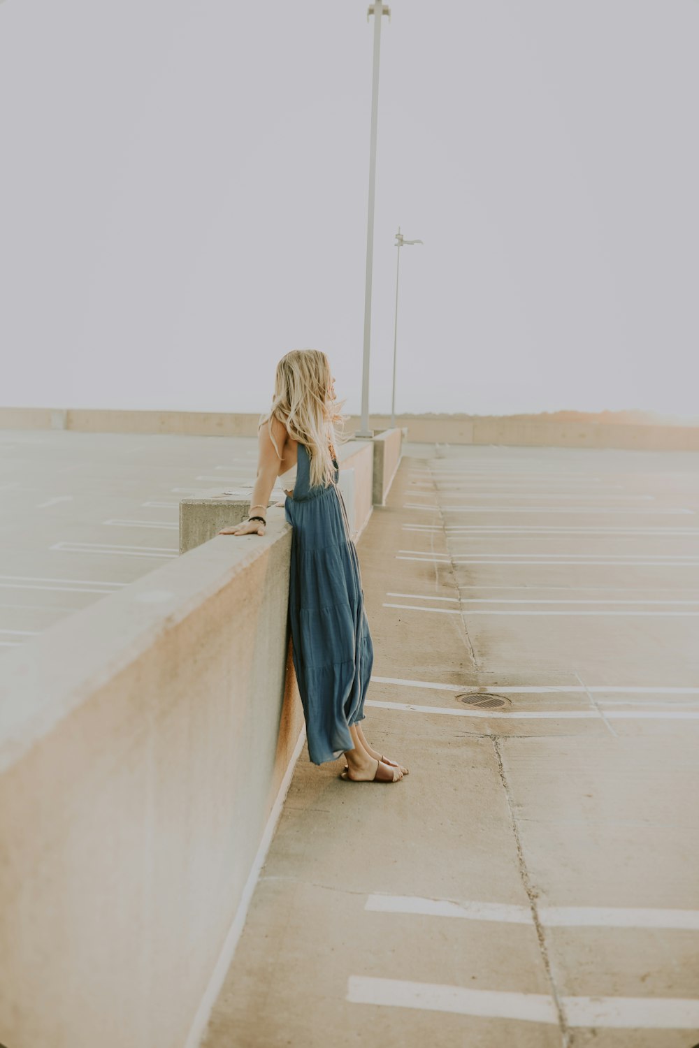 woman leaning on wall