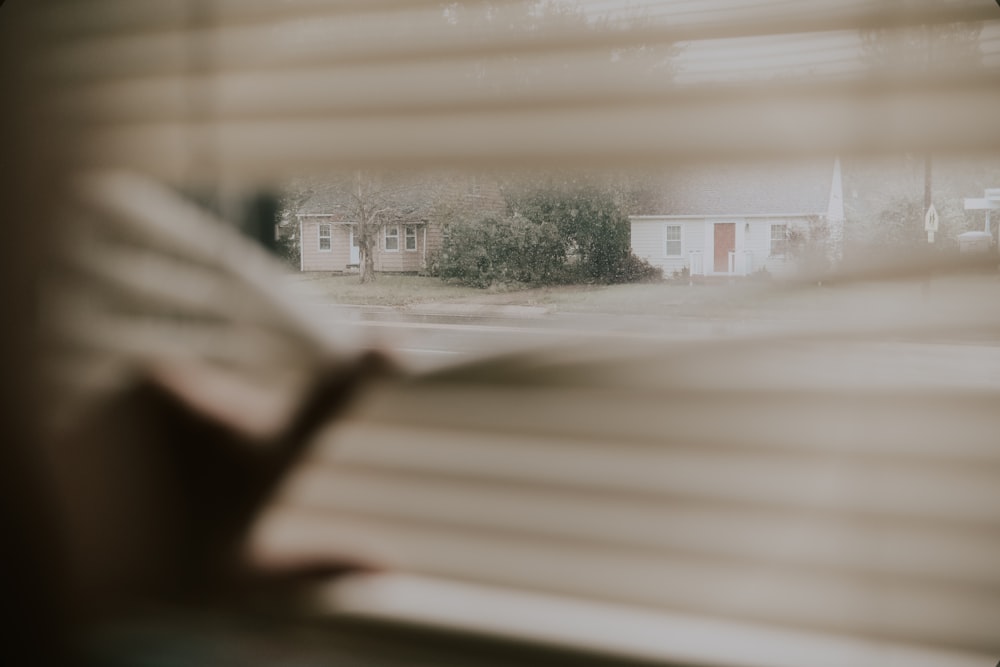 a blurry photo of a house through a window