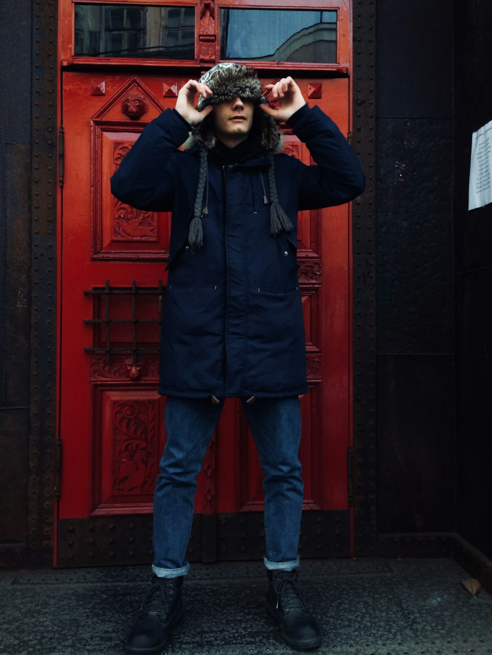 man standing near door during daytme