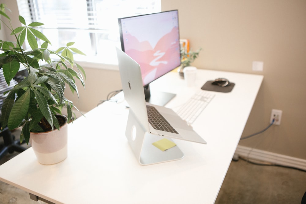 MacBook Pro placed on brown table