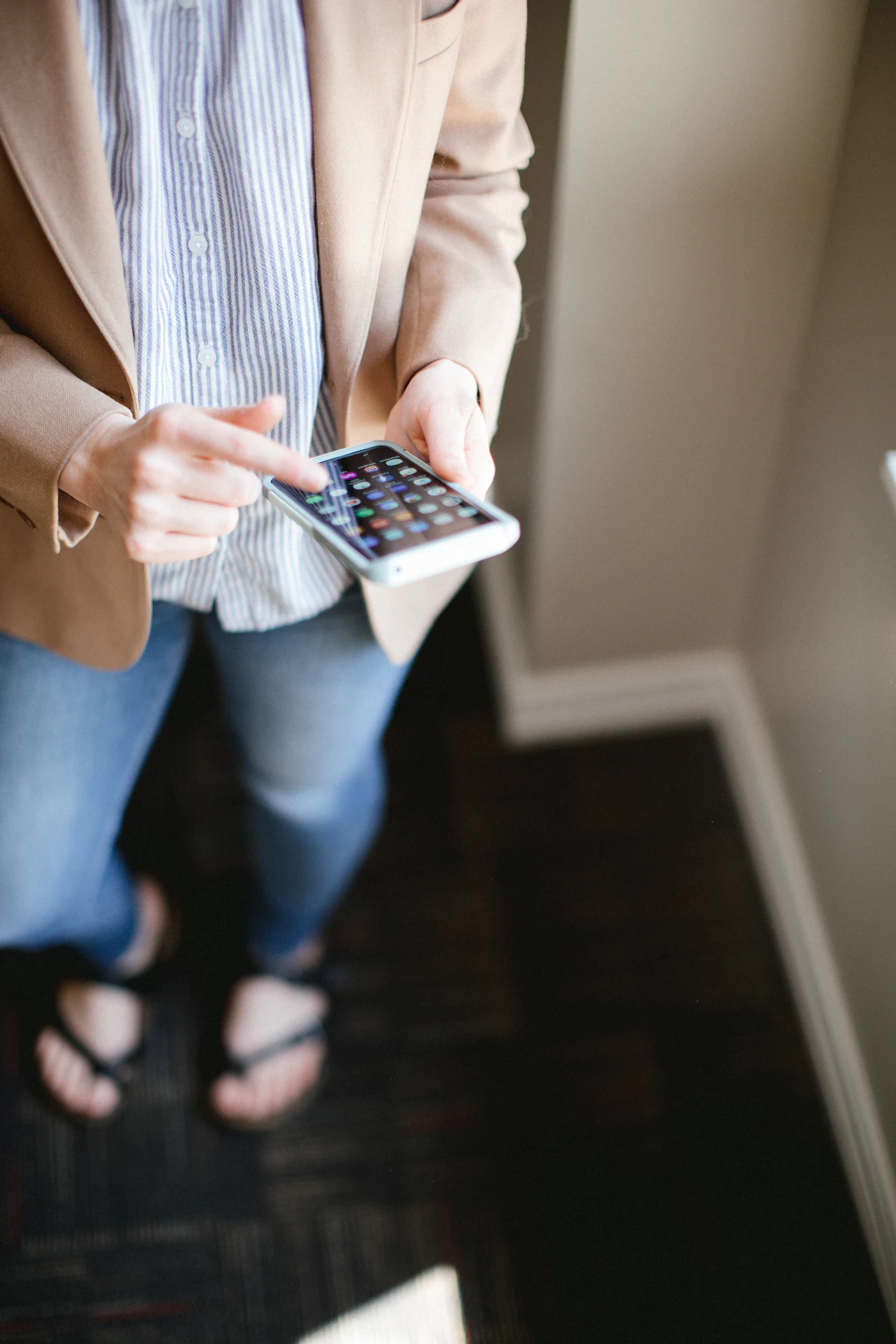 A guest using a smartphone inside a hotel room