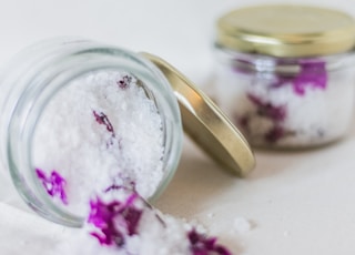 white salt on glass jar