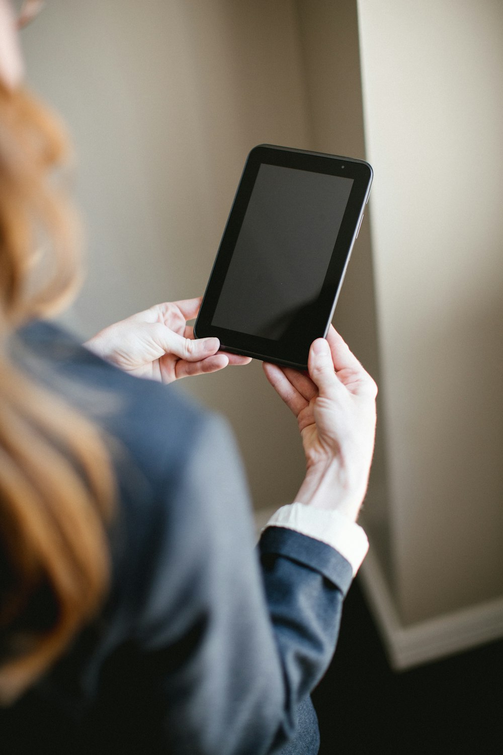 person holding tablet computer