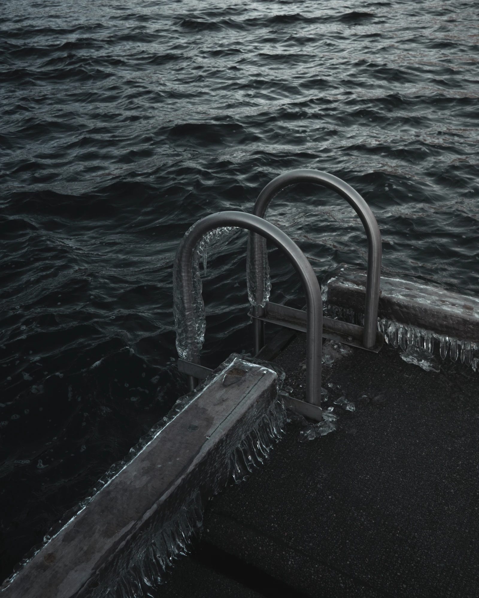 Swimmer diving into a cold outdoor pool