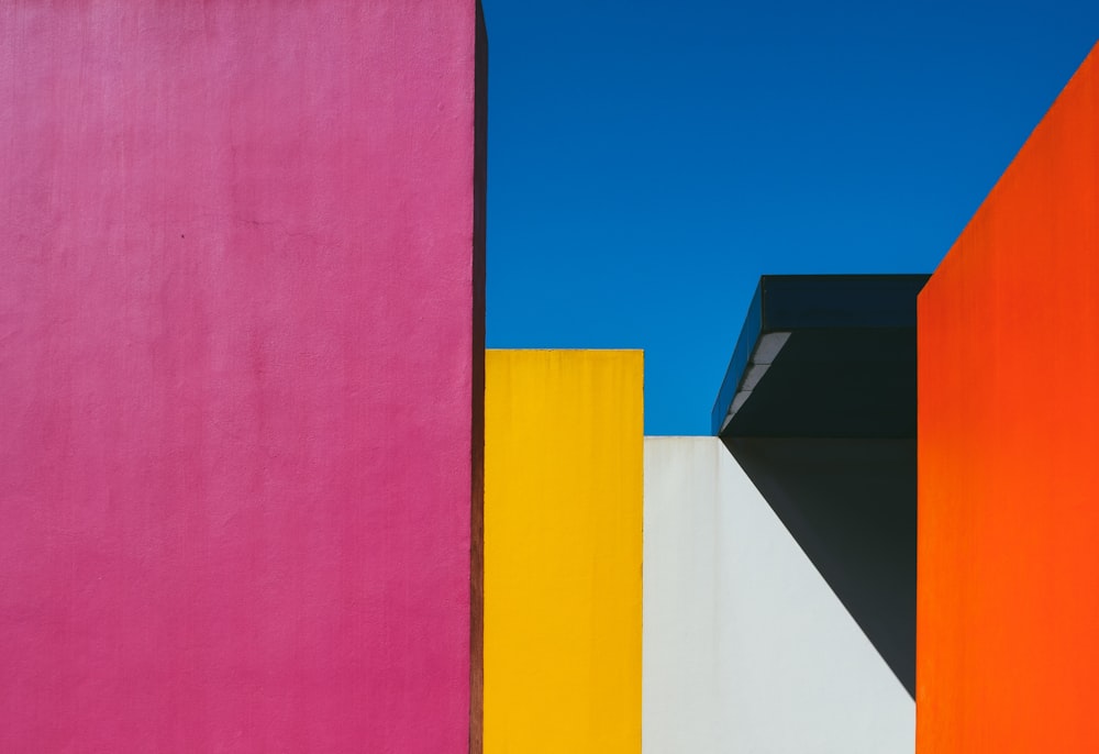 a colorful building with a blue sky in the background