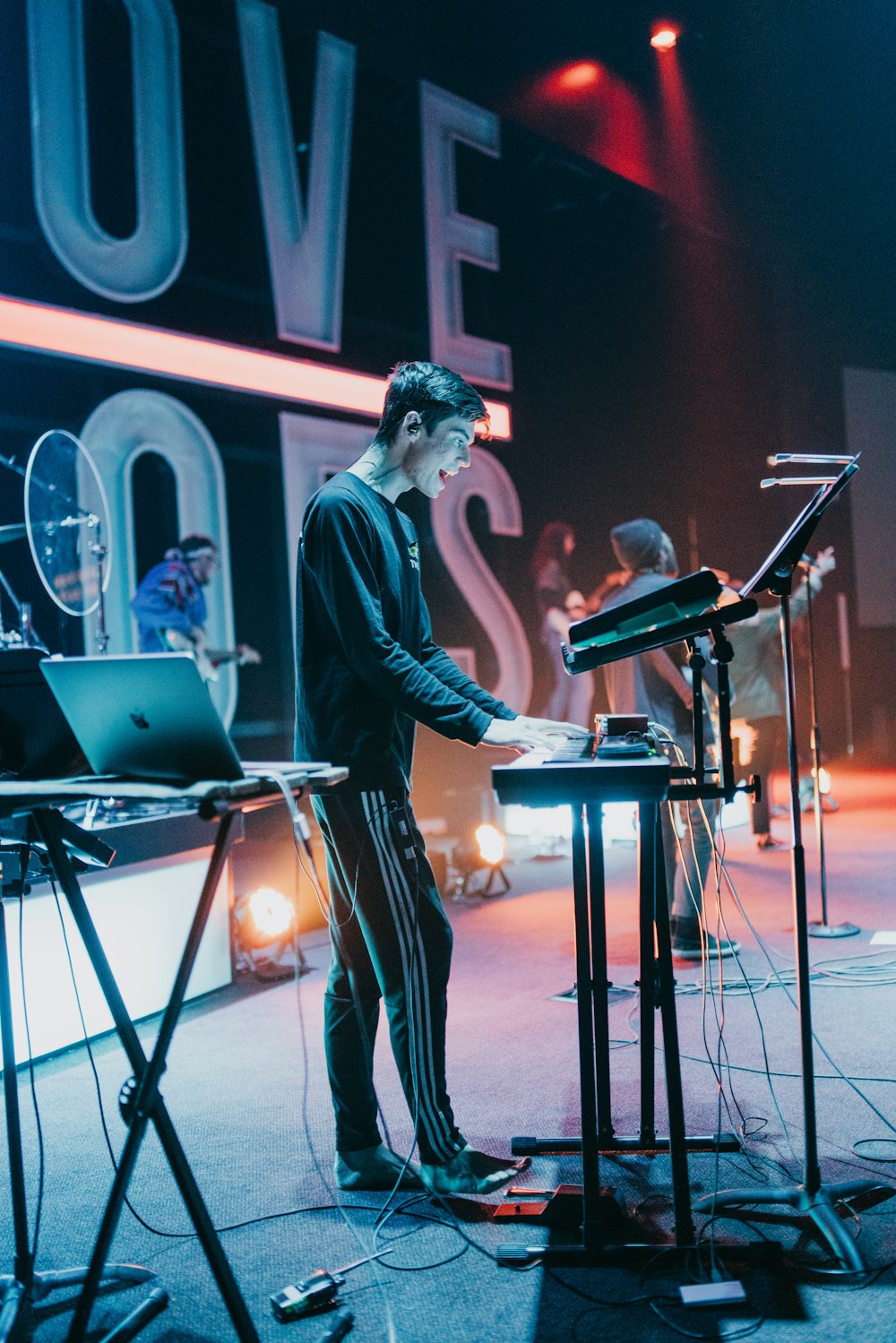 selective focus photography of man playing piano