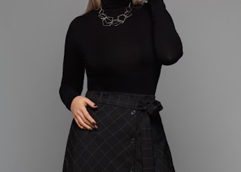 woman wearing black turtleneck long-sleeved dress