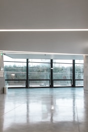 white ceramic floor tiles inside white room