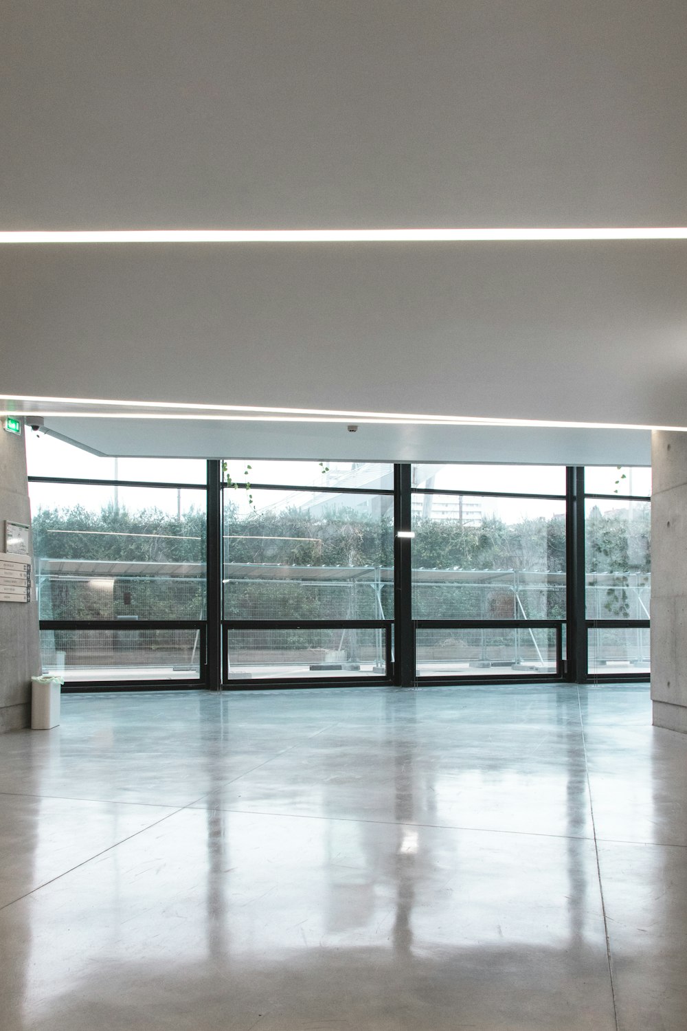 white ceramic floor tiles inside white room