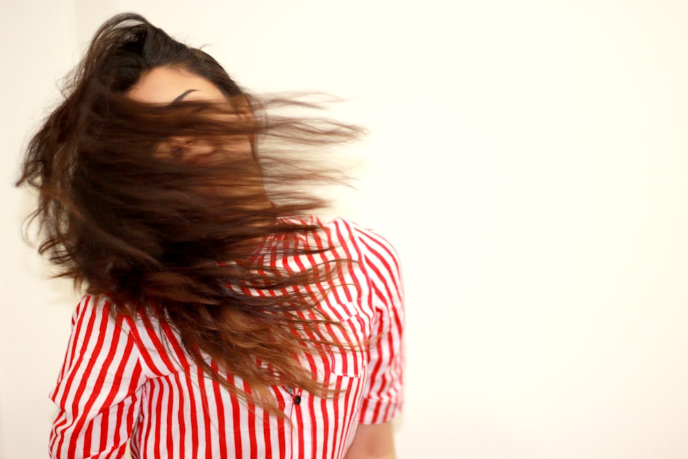 woman in red and white stripe shirt