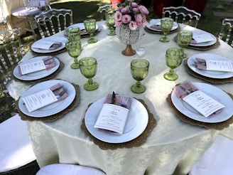 A beautifully arranged square table set for an outdoor event in Riyadh.