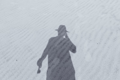 silhouette of man in hat