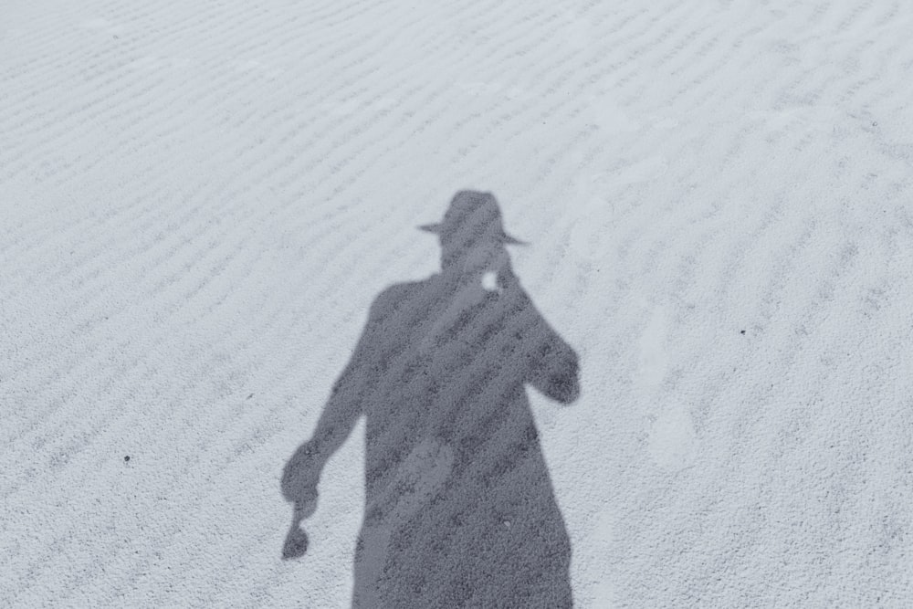 silhouette of man in hat
