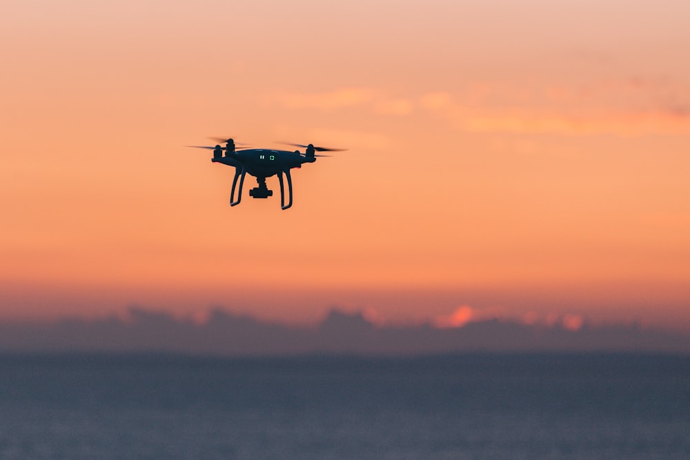 black quadcopter in sky