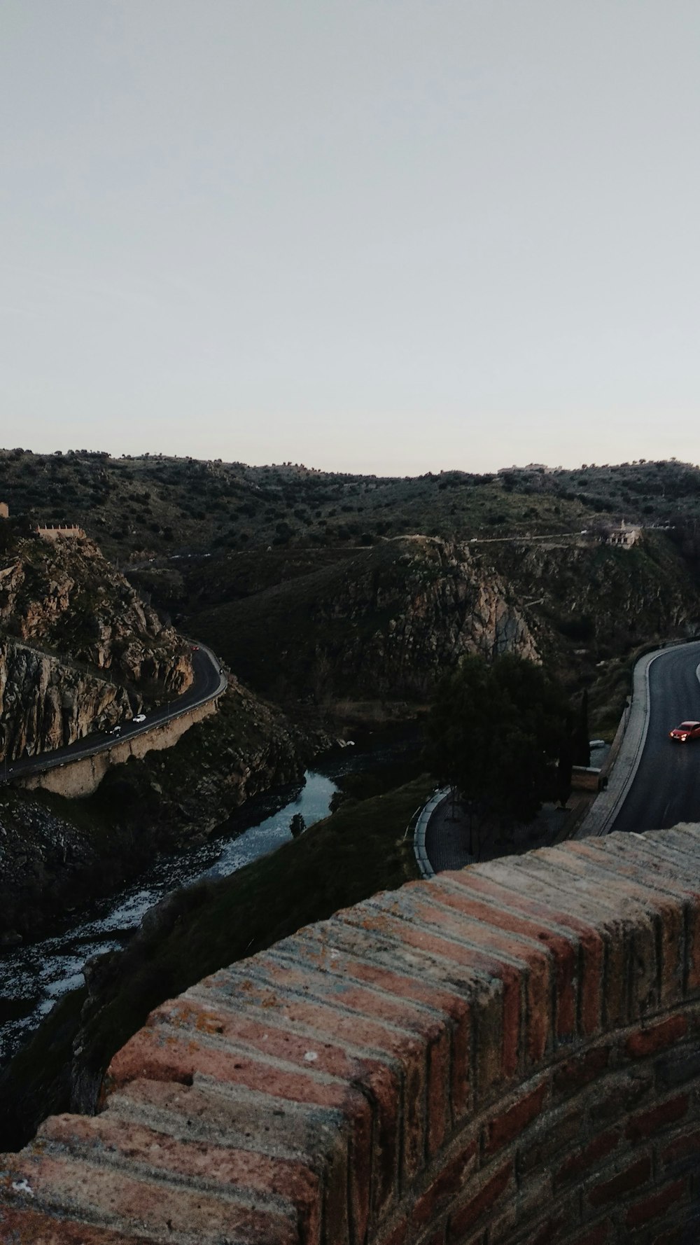 view of road on mountainous terrain during daytime