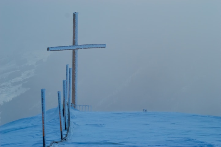 cross on snow field