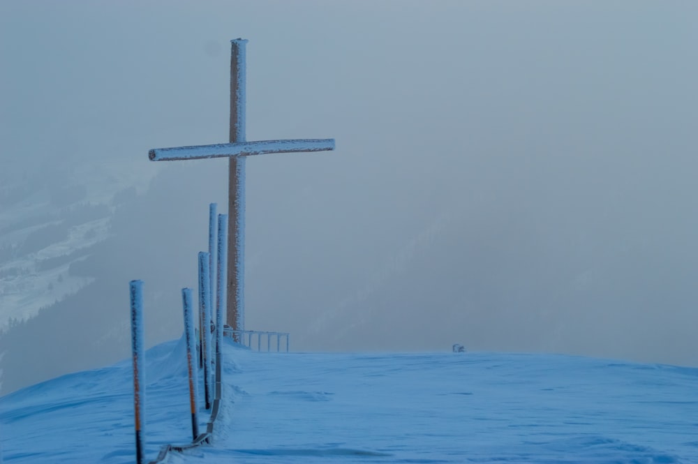 cross on snow field