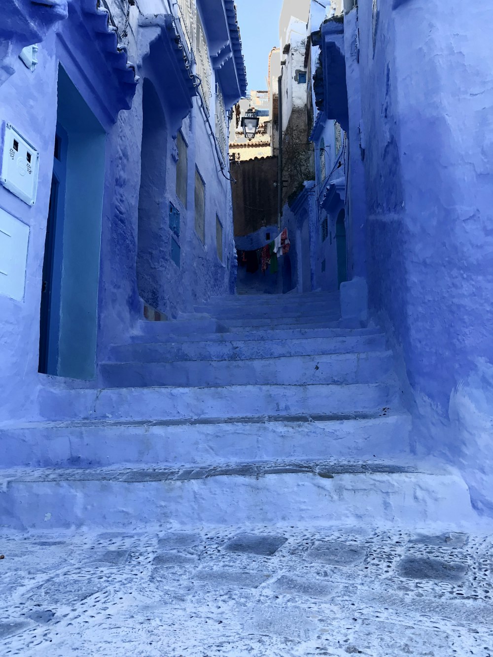 blue painted staircase and buildings
