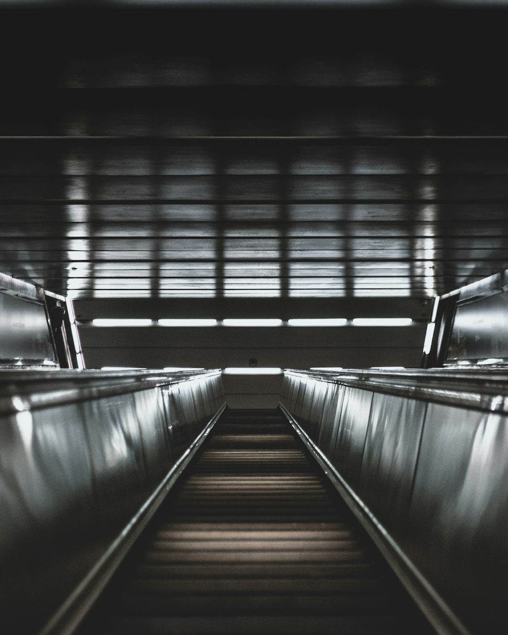 an empty escalator in a subway station