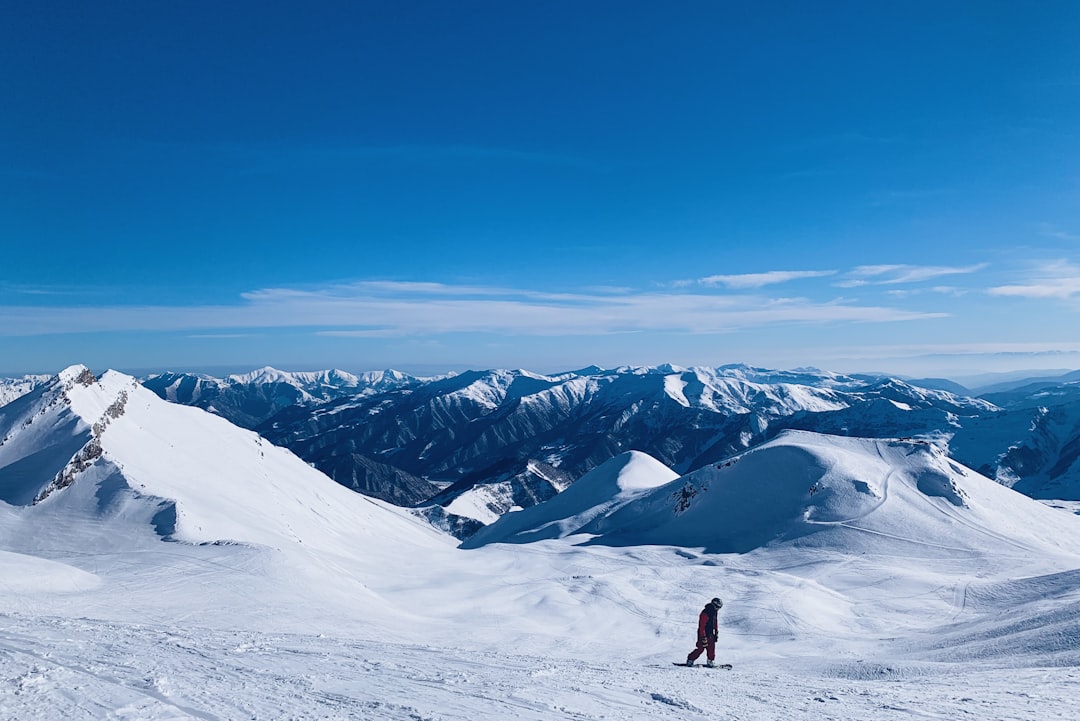 man walks at the mountain during winter